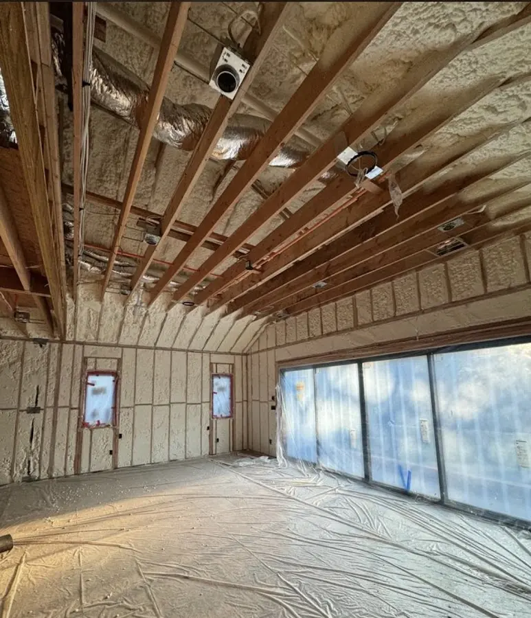 Interior walls and ceiling insulated with spray foam during new construction in Edgemere